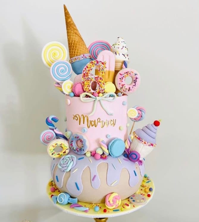 2 tier CandyLand themed cake with fondant sweets, chocolat… | Flickr